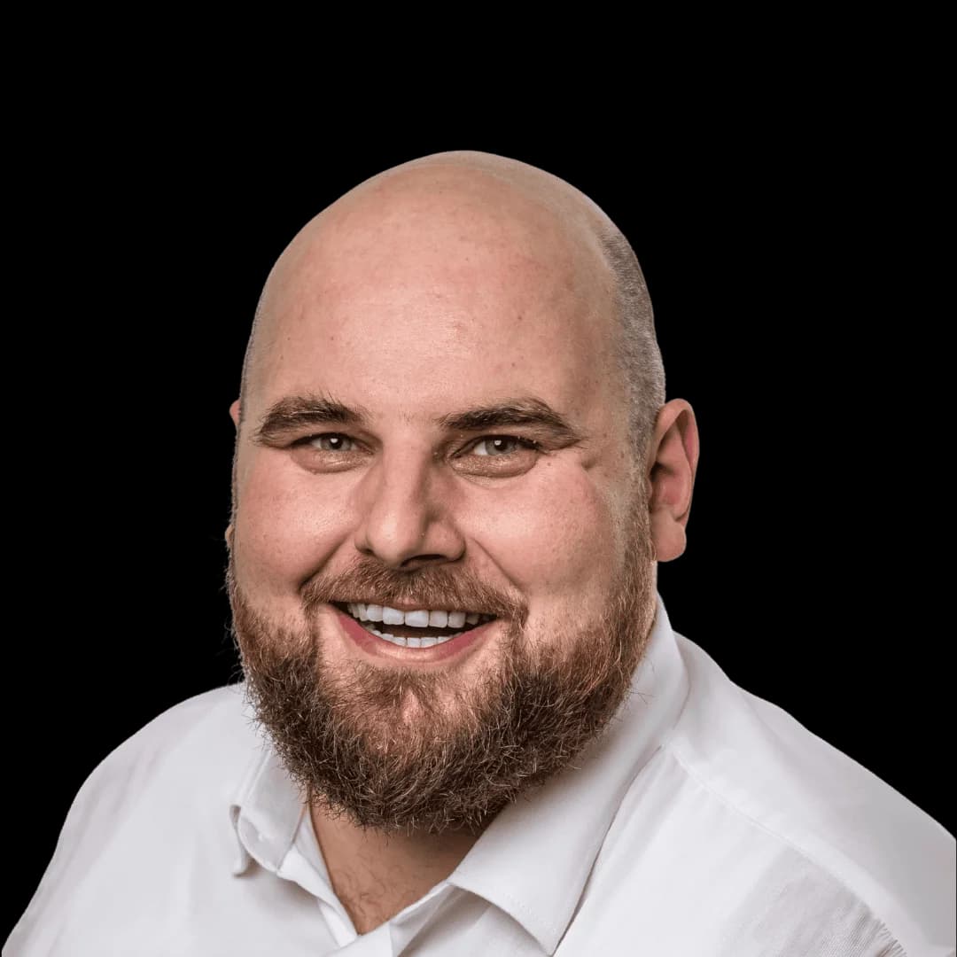 Professional headshot of Jędrzej Tabaczyński, Director of Engineering with 15+ years experience